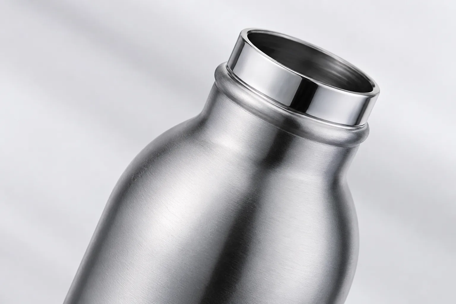A close-up shot of a polished stainless steel water bottle