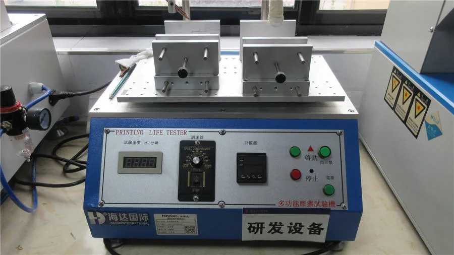 Powder coating and printed surfaces undergoing adhesion and durability inspection